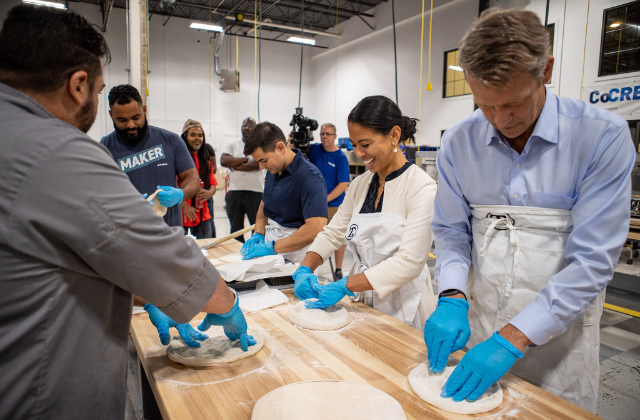 Guests make their own pizzas to help demonstrate the precision cooking of the Monogram Smart Flush Hearth Oven