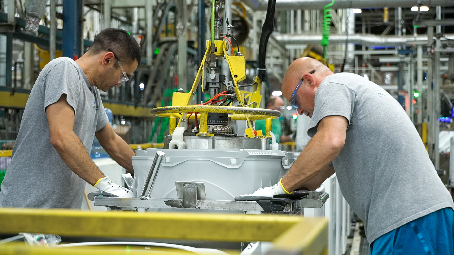Team members at our AP1 Laundry Plant work together to assemble washing machines.