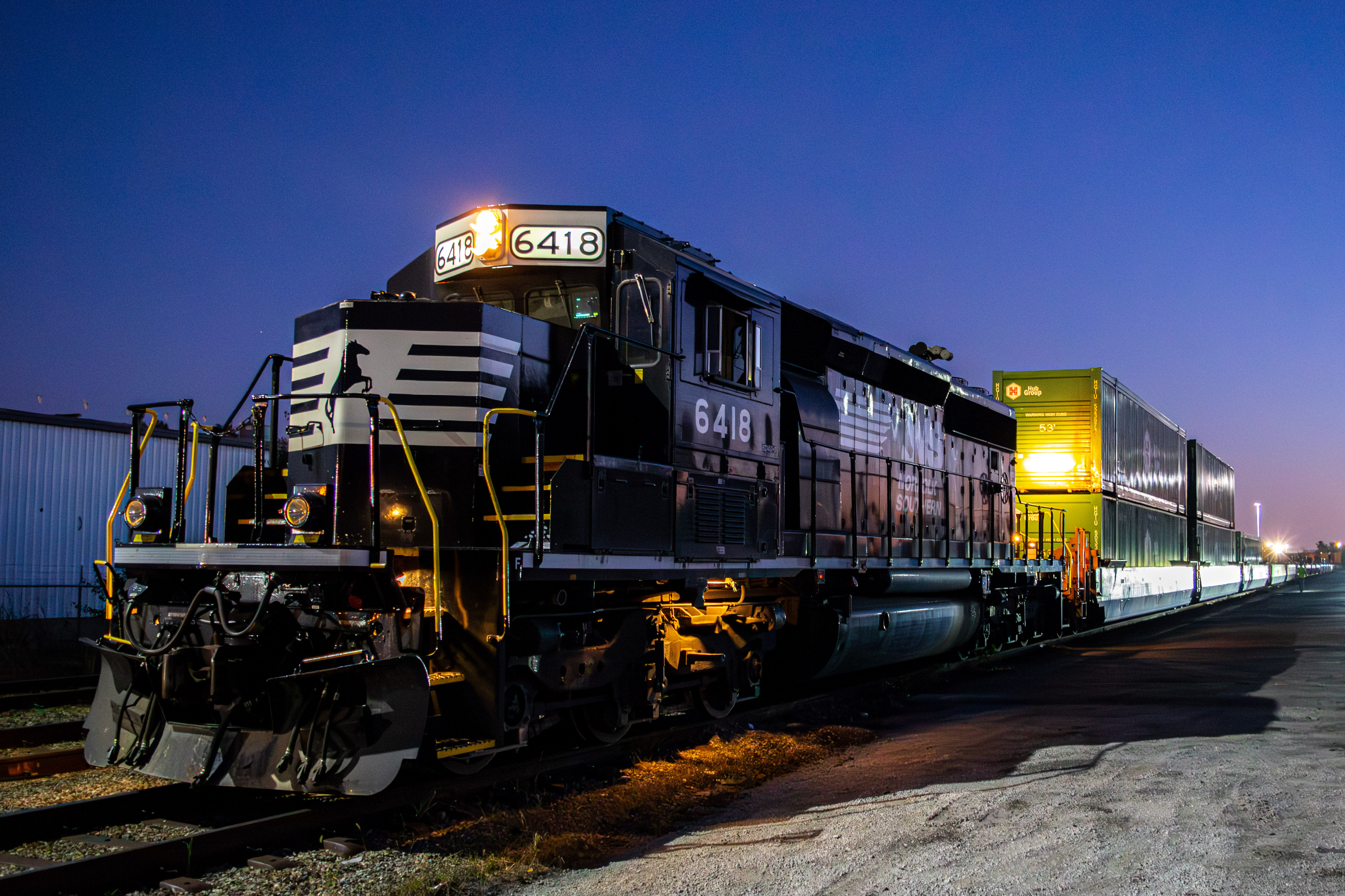 Louisville train service car sitting idle on the tracks at night
