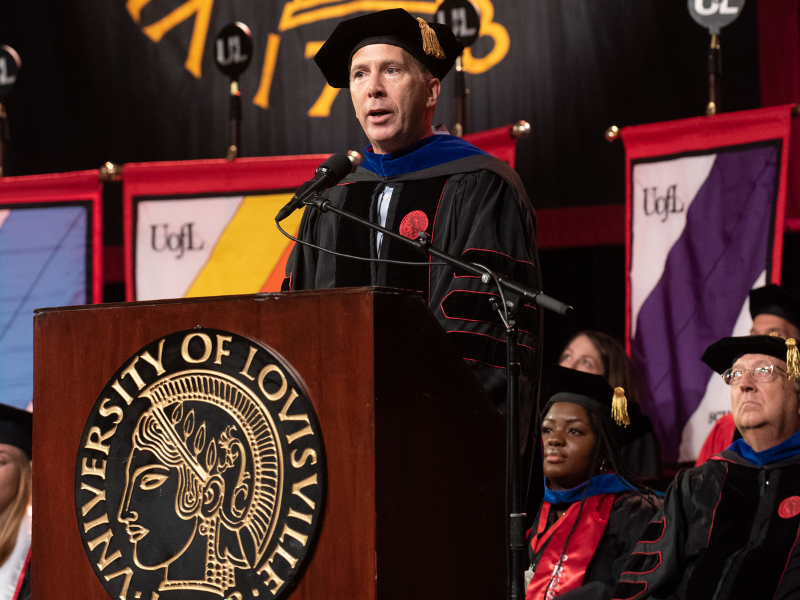 President and CEO Kevin speaks to graduates during the UofL commencement address 